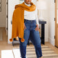 Knitted Fuzzy Pom Pom Scarf In Ginger
