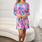 White Birch Printed V-Neck Tie Back Mini Dress