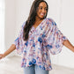 Fabled in Floral Draped Peplum Top in Blue