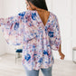 Fabled in Floral Draped Peplum Top in Blue