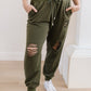 Kick Back Distressed Joggers In Olive