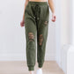 Kick Back Distressed Joggers In Olive