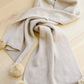 Knitted Fuzzy Pom Pom Scarf In Beige