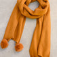 Knitted Fuzzy Pom Pom Scarf In Ginger