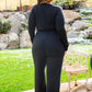 Onward & Upward Faux Wrap Jumpsuit In Black