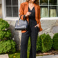 Onward & Upward Faux Wrap Jumpsuit In Black