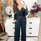 Onward & Upward Faux Wrap Jumpsuit In Black